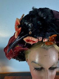 Autumn antique hat with exotic bird decoration, black lace and foliage, early 20th century