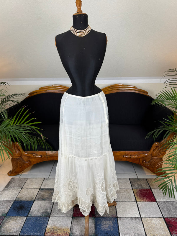 Antique Edwardian petticoat from Lady Gillman's 1911 bridal trousseau with silk waist, whitework embroidery, daisy motifs, and lace flounces