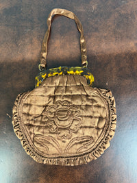 Antique brown quilted silk handbag with floral motif and faux tortoiseshell clasp