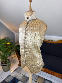 Cream silk embroidered Georgian waistcoat c.1770 from England with long‑line silhouette and floral detailing.