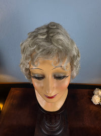 Antique theatrical wig c.1890 made of horsehair with black silk bow from Clarkson’s Wellington Street workshop