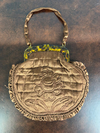 Early 20th‑century quilted silk purse with floral design and silk handle