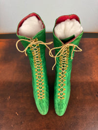 Victorian green silk lace‑up boots, c.1875, with brass fasteners, red leather lining and vivid aniline‑dyed colour