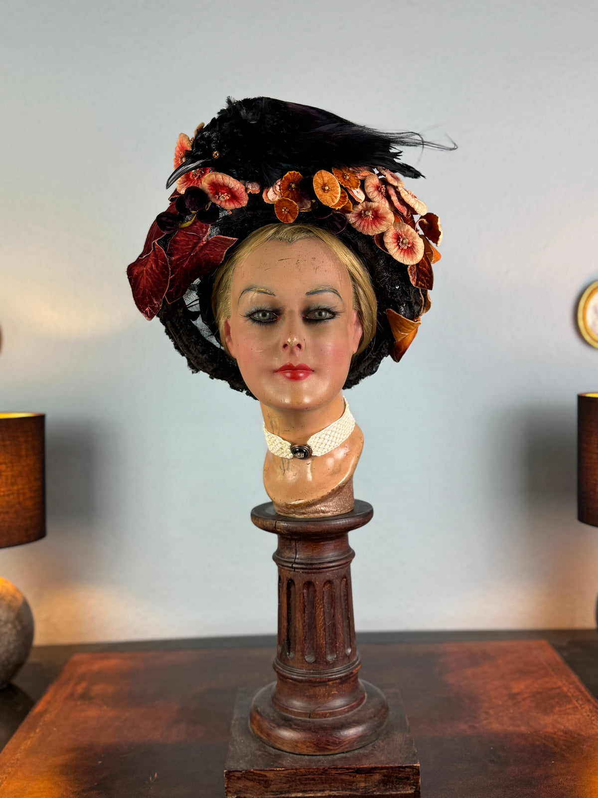 Autumn antique hat with exotic bird decoration, black lace and foliage, early 20th century