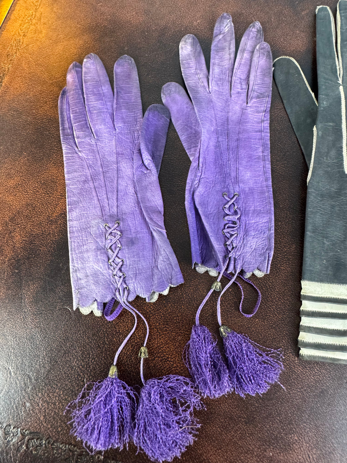 Three pairs of antique gloves from 1860s to early 20th century, goatskin