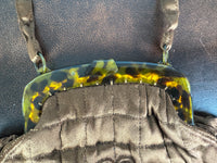 Antique brown quilted silk handbag with floral motif and faux tortoiseshell clasp