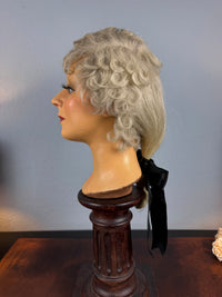 Antique theatrical wig c.1890 made of horsehair with black silk bow from Clarkson’s Wellington Street workshop
