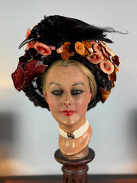 Autumn antique hat with exotic bird decoration, black lace and foliage, early 20th century
