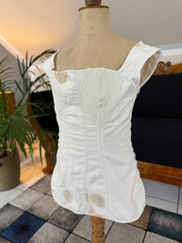 Antique corded cotton corset ca. 1825–1830 with shaped bust, bone eyelets and handwritten owner’s name, early 19th‑century Regency corsetry