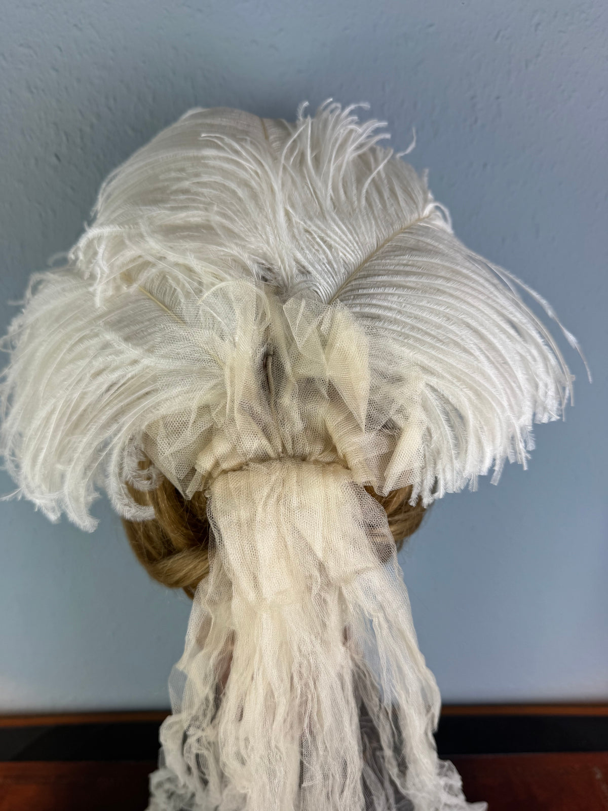 Antique white ostrich feather and tulle hair accessory, late Victorian era.