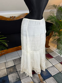 Antique Edwardian petticoat from Lady Gillman's 1911 bridal trousseau with silk waist, whitework embroidery, daisy motifs, and lace flounces