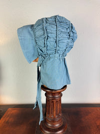 Antique Victorian blue cotton sunbonnet, ca. 1900, ruched brim.