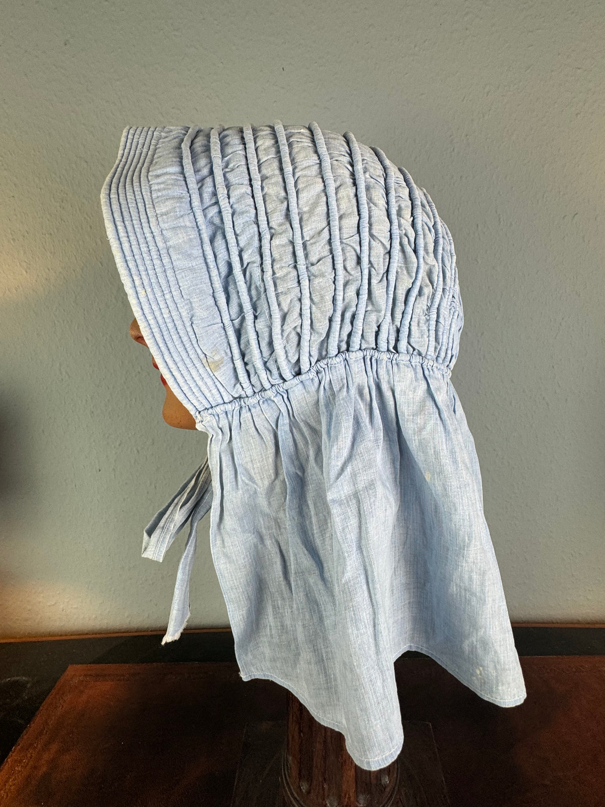 Victorian light‑blue sunbonnet, handmade quilted brim, rural workwear