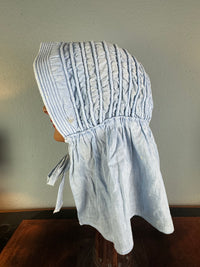 Victorian light‑blue sunbonnet, handmade quilted brim, rural workwear