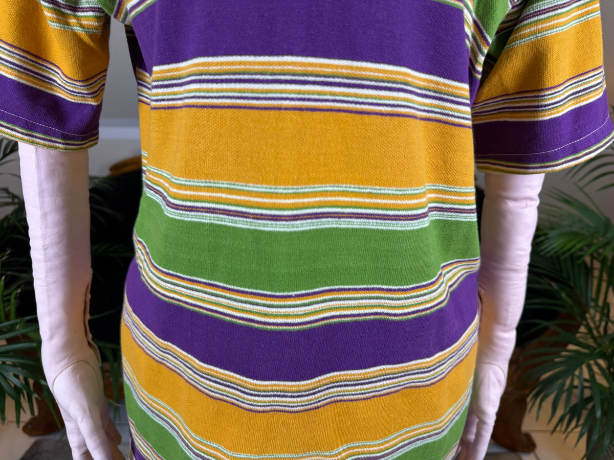 1920s bathing costume with short‑sleeved top and striped shorts