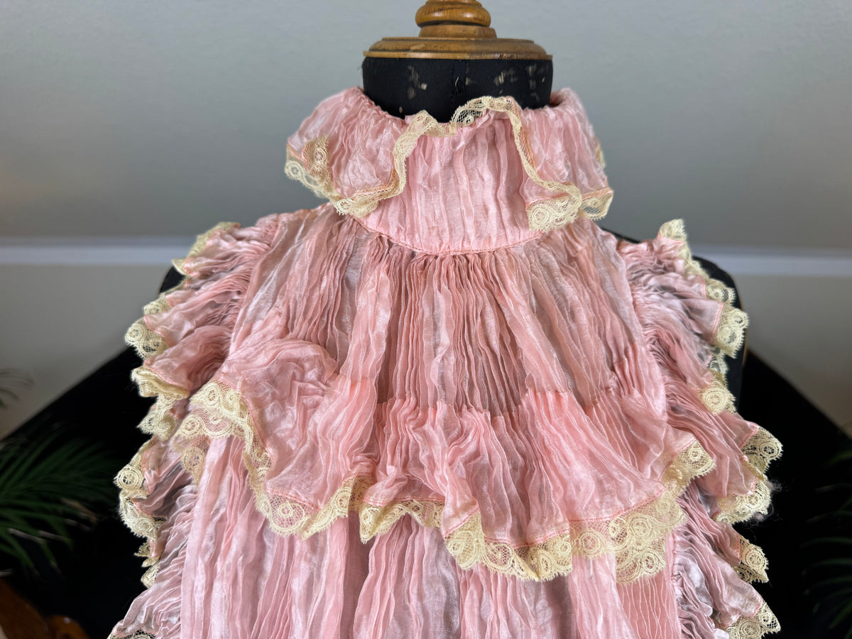 Pink ruffled French bust insert c.1901 with high standing collar and layered Belle Époque frills.