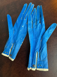 Victorian purple lace‑up gloves with pompoms, 1860s