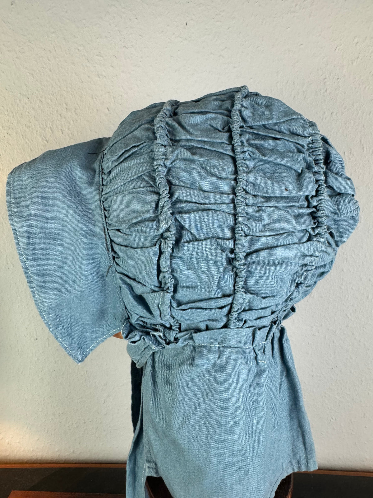 Antique Victorian blue cotton sunbonnet, ca. 1900, ruched brim.