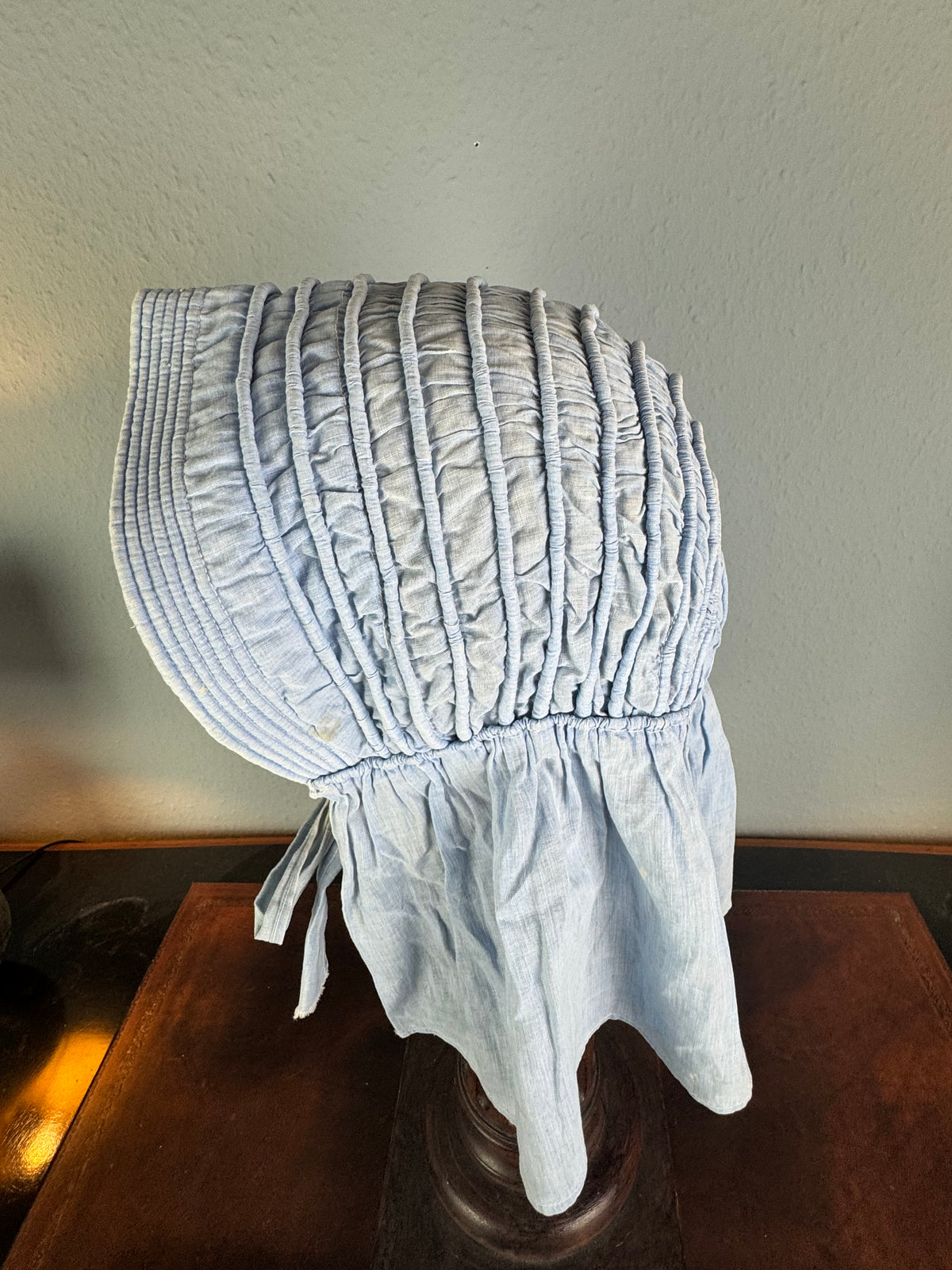Victorian light‑blue sunbonnet, handmade quilted brim, rural workwear