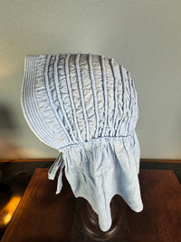 Victorian light‑blue sunbonnet, handmade quilted brim, rural workwear