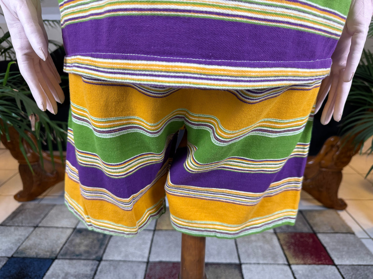 1920s bathing costume with short‑sleeved top and striped shorts