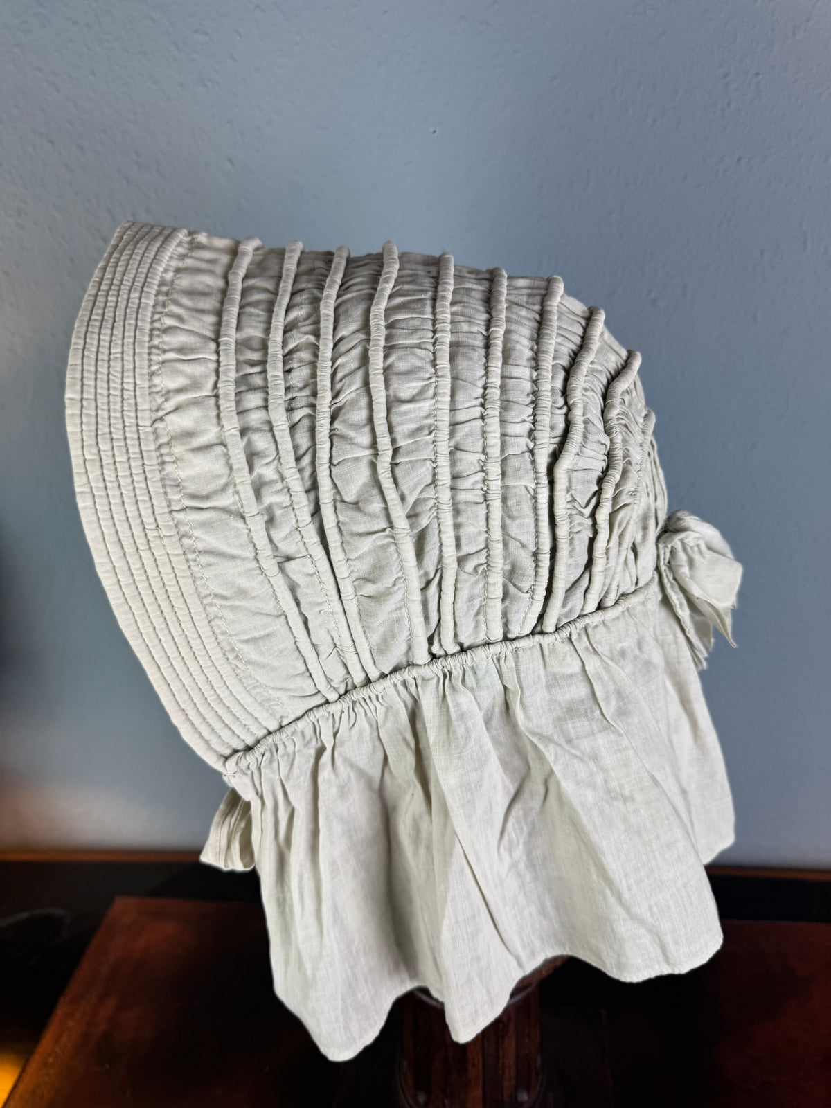 1900s light‑green quilted cotton bonnet with smooth neck curtain