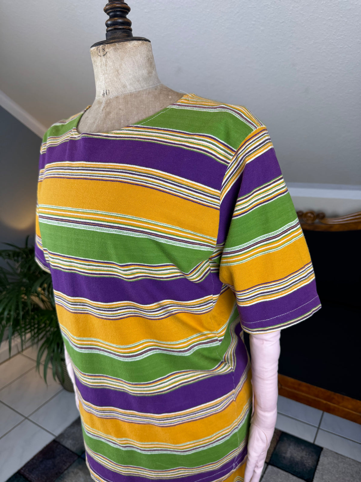 1920s bathing costume with short‑sleeved top and striped shorts