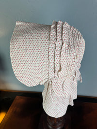 Antique Victorian printed cotton sunbonnet with wide quilted brim, ca. 1900