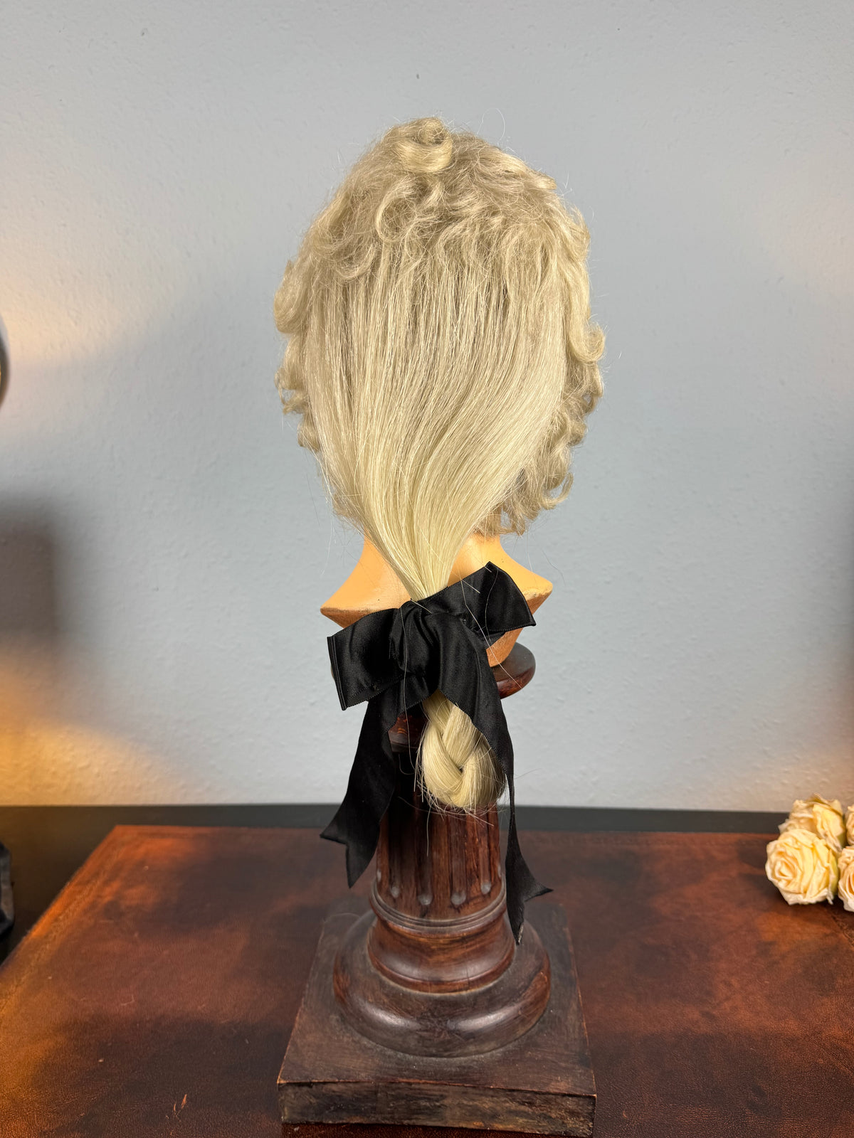 Antique theatrical wig c.1890 made of horsehair with black silk bow from Clarkson’s Wellington Street workshop