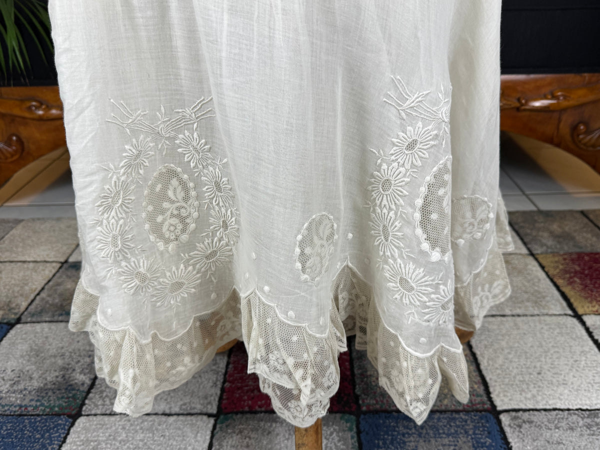 Antique Edwardian petticoat from Lady Gillman's 1911 bridal trousseau with silk waist, whitework embroidery, daisy motifs, and lace flounces