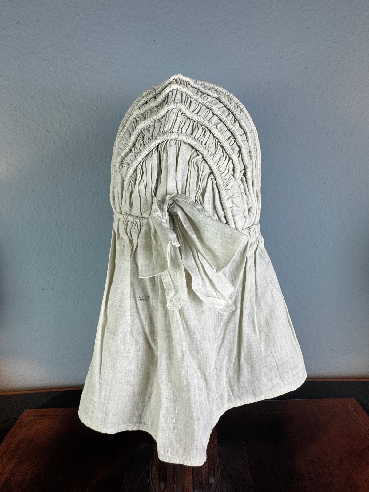 1900s light‑green quilted cotton bonnet with smooth neck curtain