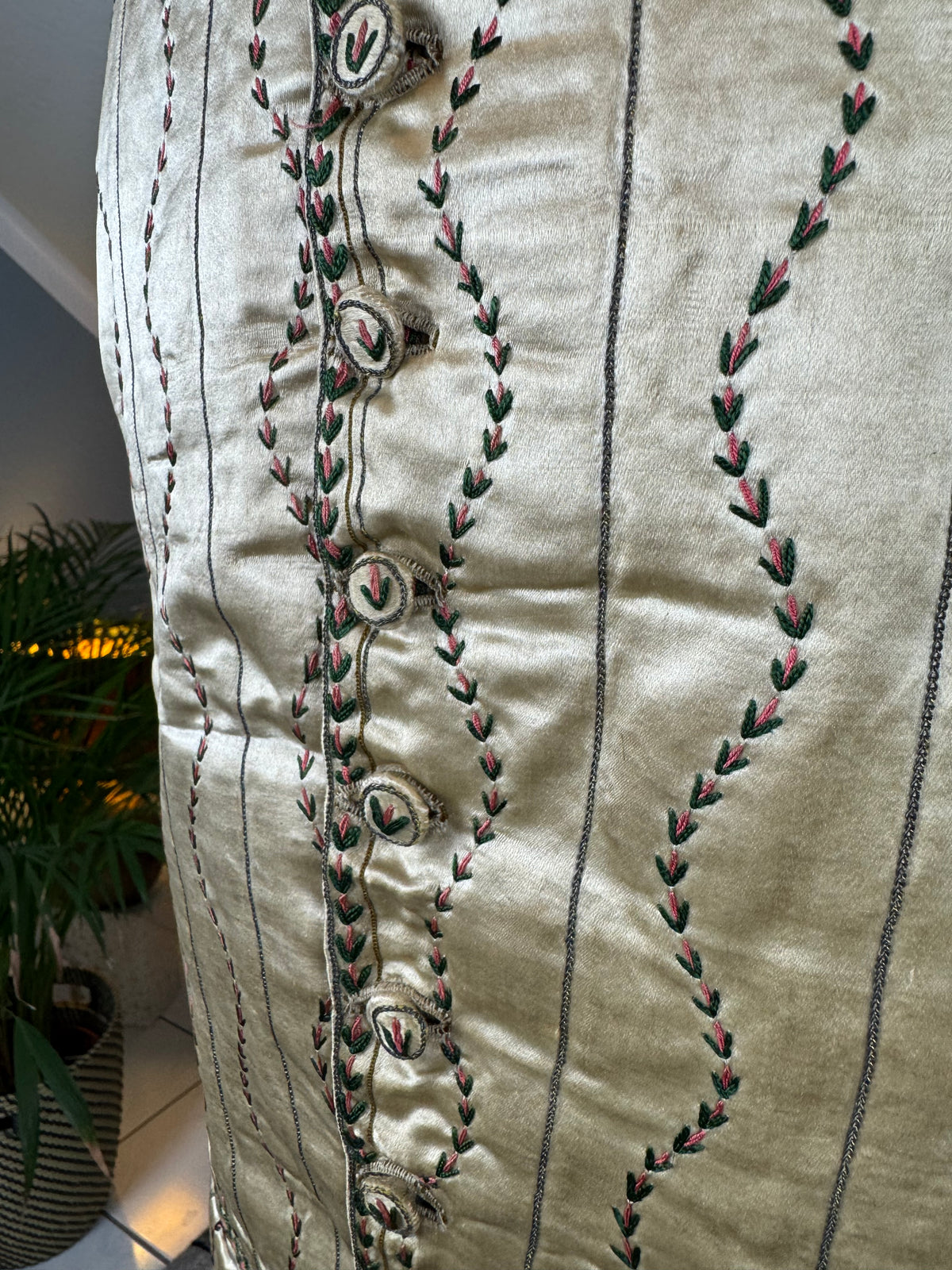 Cream silk embroidered Georgian waistcoat c.1770 from England with long‑line silhouette and floral detailing.