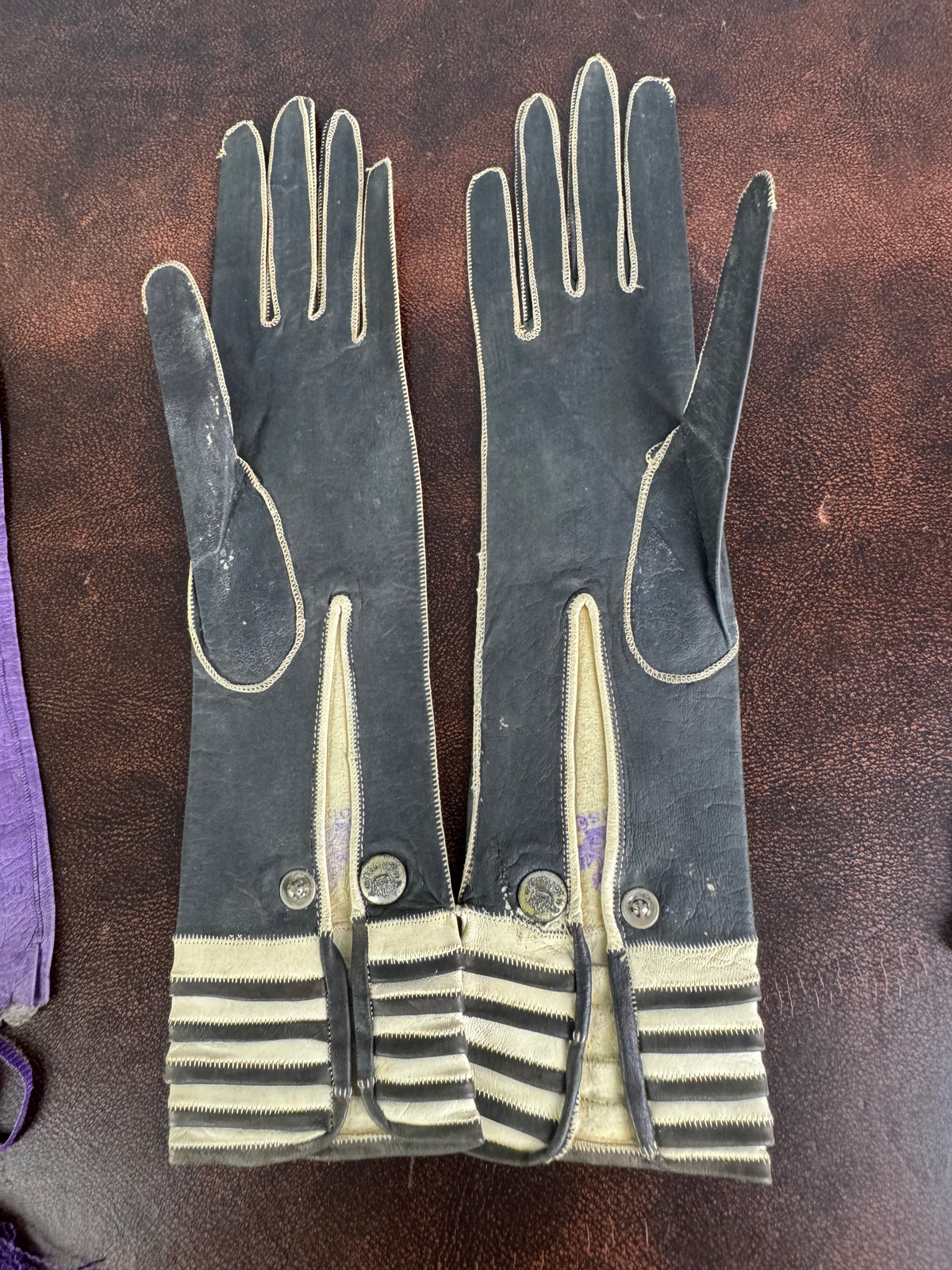Victorian purple lace‑up gloves with pompoms, 1860s
