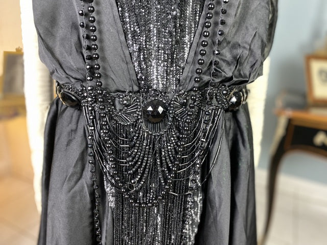 1918 black silk evening dress with sequins, cabochon stones and narrow train, antique transitional gown
