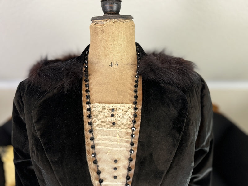 1912 American Edwardian walking dress in dark velvet with lace collar, long skirt and decorative buttons, antique gown