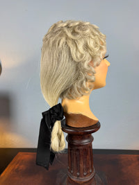 Antique theatrical wig c.1890 made of horsehair with black silk bow from Clarkson’s Wellington Street workshop