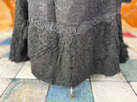 Antique two‑piece dress with pigeon‑breast bodice and silk appliqués