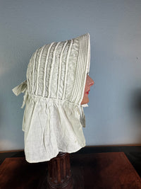 Victorian light‑blue sunbonnet, handmade quilted brim, rural workwear