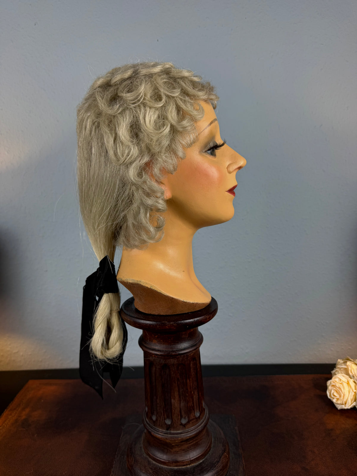 Antique theatrical wig c.1890 made of horsehair with black silk bow from Clarkson’s Wellington Street workshop