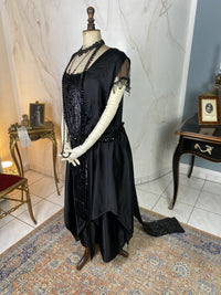 1918 black silk evening dress with sequins, cabochon stones and narrow train, antique transitional gown