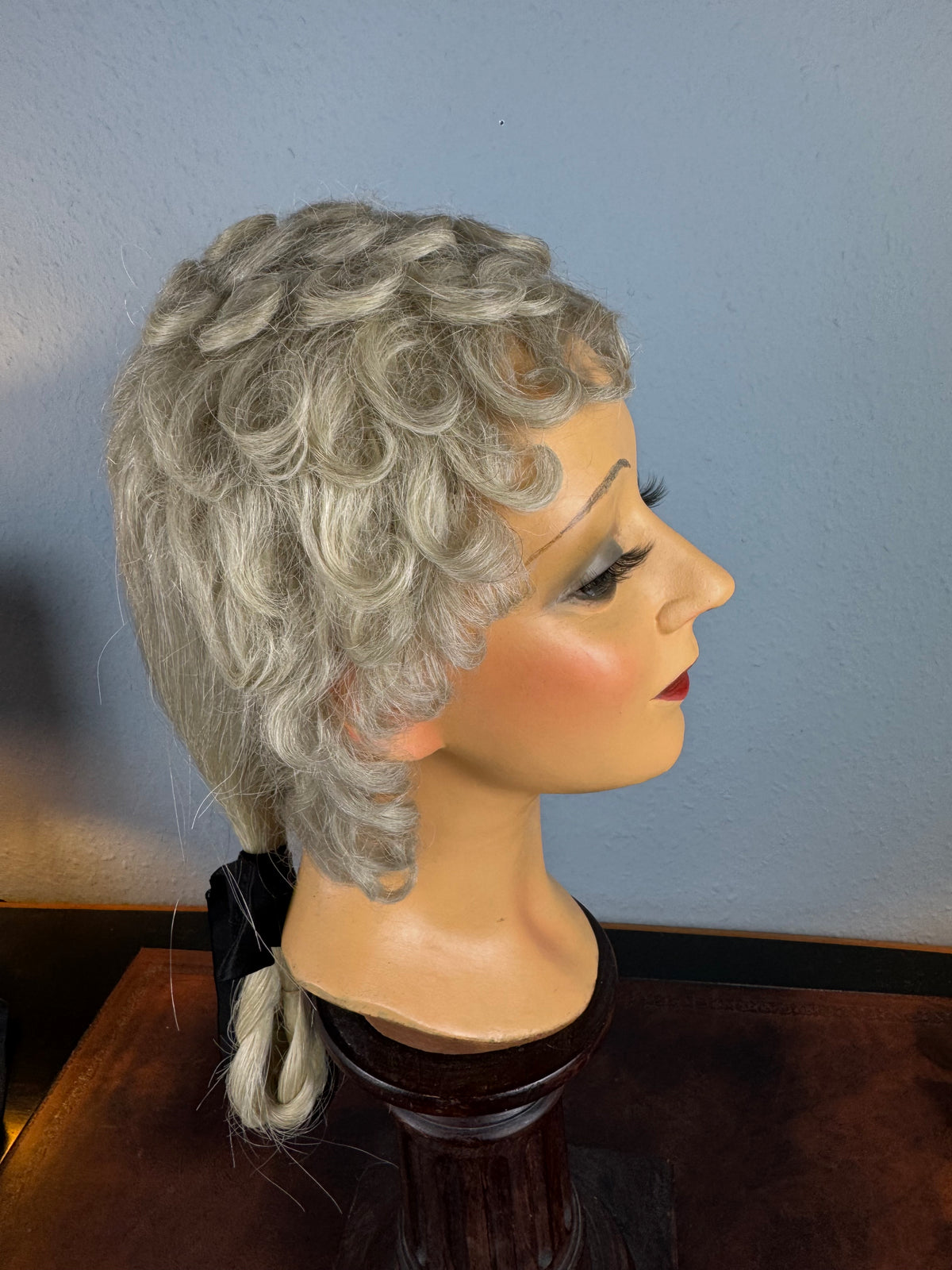 Antique theatrical wig c.1890 made of horsehair with black silk bow from Clarkson’s Wellington Street workshop