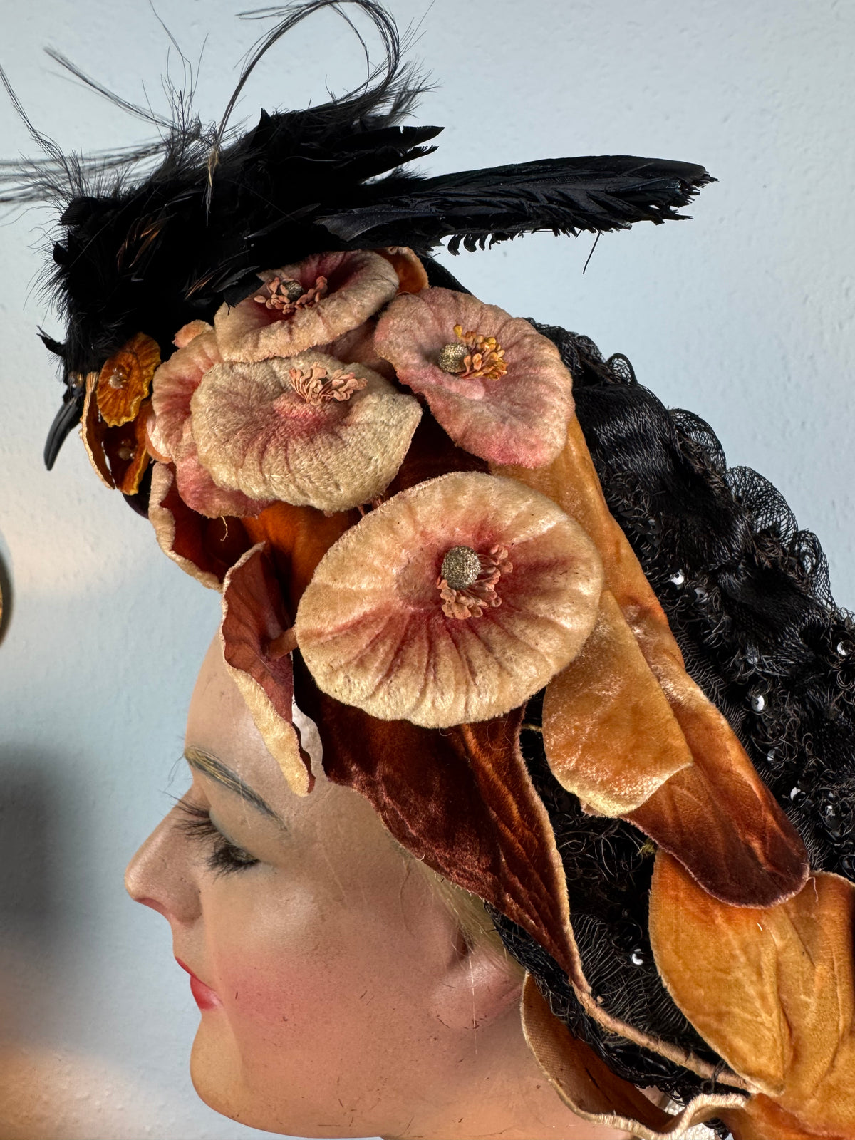 Early 20th‑century millinery hat with exotic bird mount, black lace and naturalistic trim