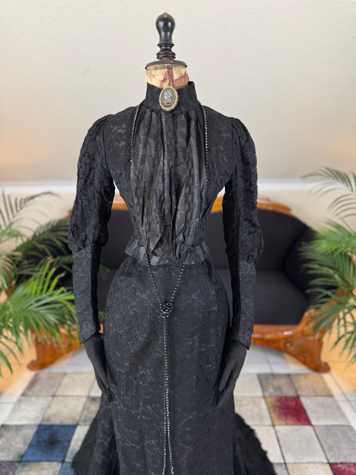 Antique two‑piece dress with pigeon‑breast bodice and silk appliqués