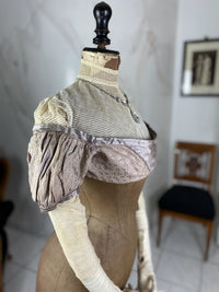 1805 white silk Regency Spencer with short sleeves, high waistline and decorative front closure, antique garment