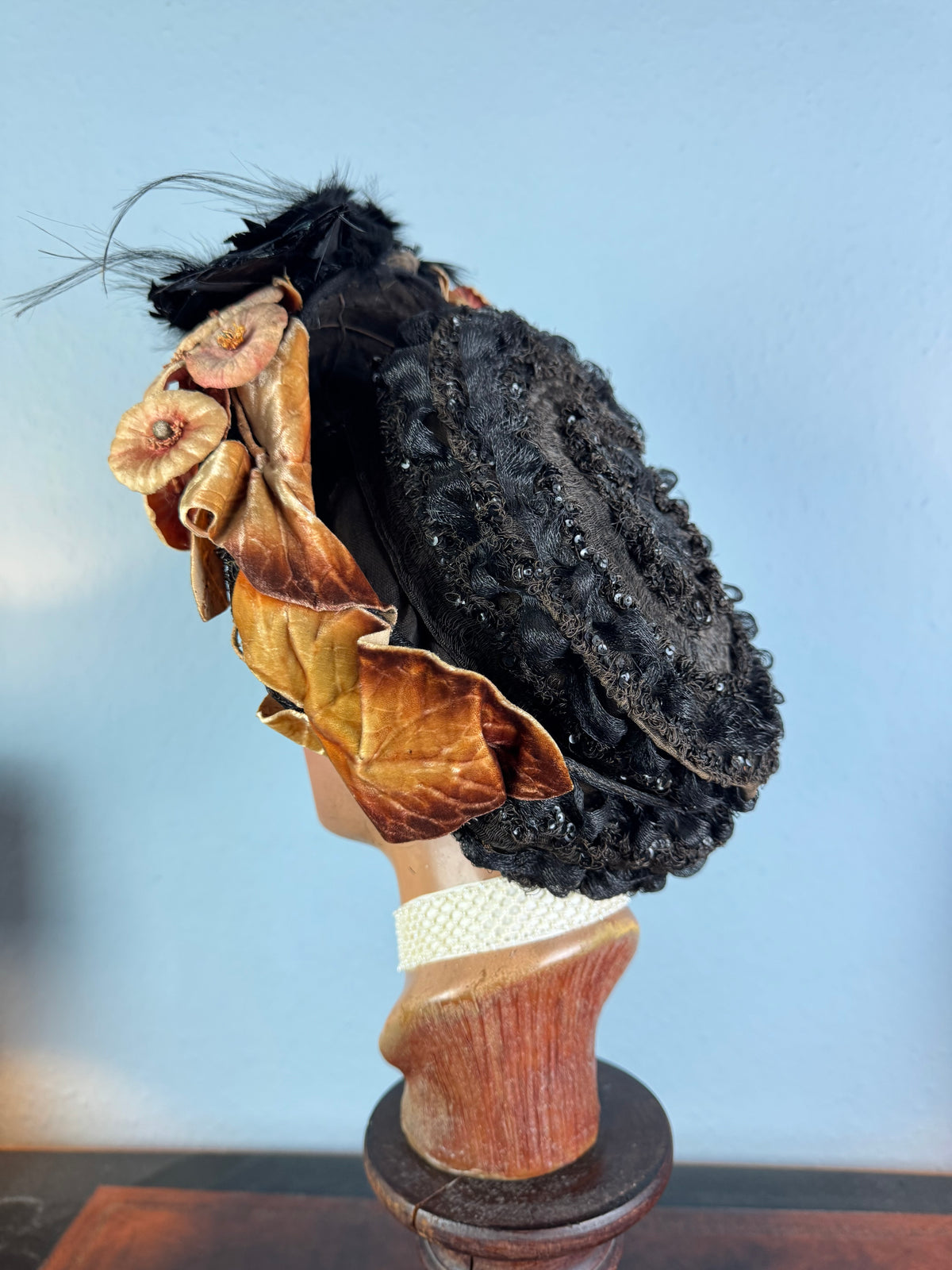 Early 20th‑century millinery hat with exotic bird mount, black lace and naturalistic trim