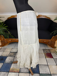 Antique Edwardian petticoat from Lady Gillman's 1911 bridal trousseau with silk waist, whitework embroidery, daisy motifs, and lace flounces
