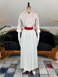 Natural Fiber Daywear Set — Linen skirt, red‑pattern cotton blouse with sailor collar, white leather shoes, red belt.