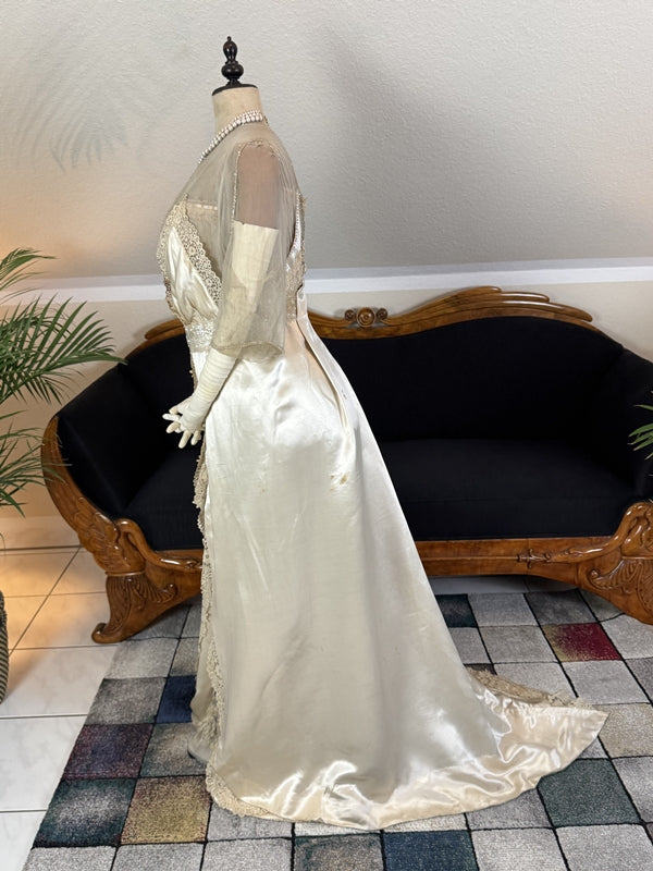 Early 20th‑century Almera Robes London dress with beaded belt, tulle sleeves and long lace train, antique couture gown