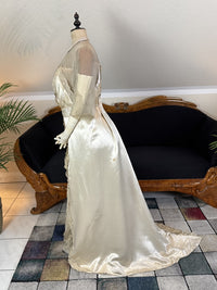 Early 20th‑century Almera Robes London dress with beaded belt, tulle sleeves and long lace train, antique couture gown