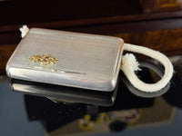Silver cigarette case of Crown Prince Wilhelm of Prussia with crowned monogram, presentation pin and original caricature in bespoke casket.